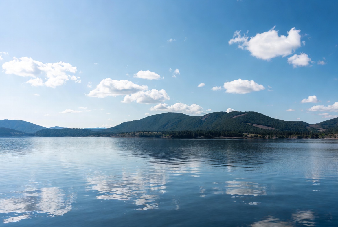 Mountain lake with clear sky and clouds Mountain lake with clear sky and clouds