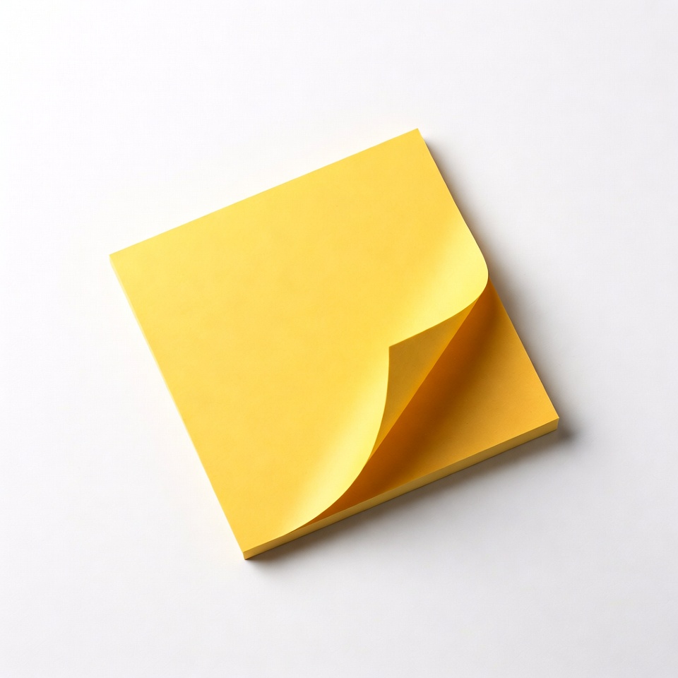 Yellow sticky note on white surface Yellow sticky note on white surface