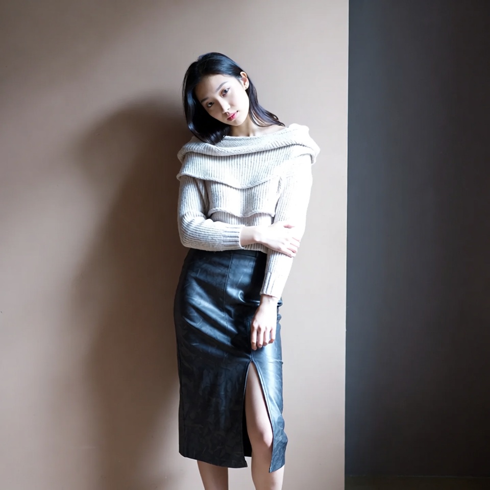 Model poses in stylish outfit indoors Model poses in stylish outfit indoors