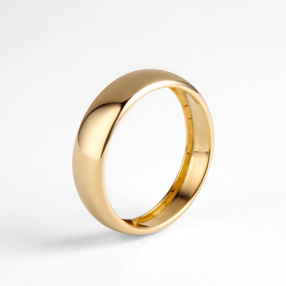 Simple gold wedding ring on display Simple gold wedding ring on display