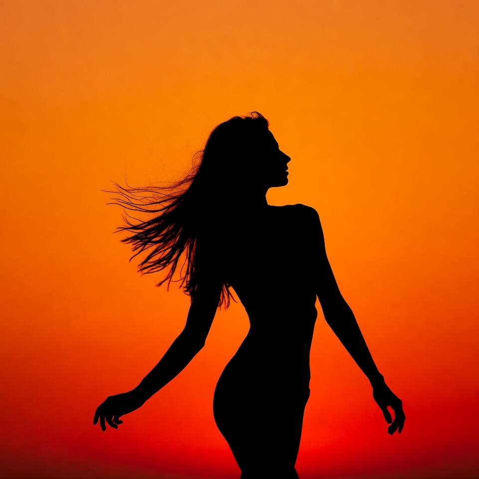 Woman dancing at sunset silhouette Woman dancing at sunset silhouette