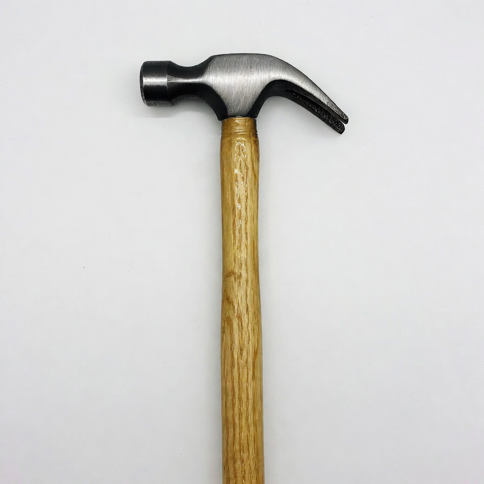 Hammer with wooden handle on white background Hammer with wooden handle on white background