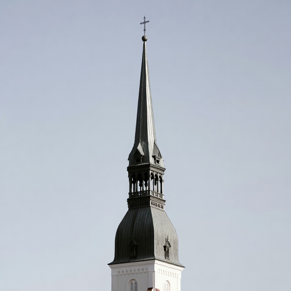 Tall church spire against blue sky Tall church spire against blue sky