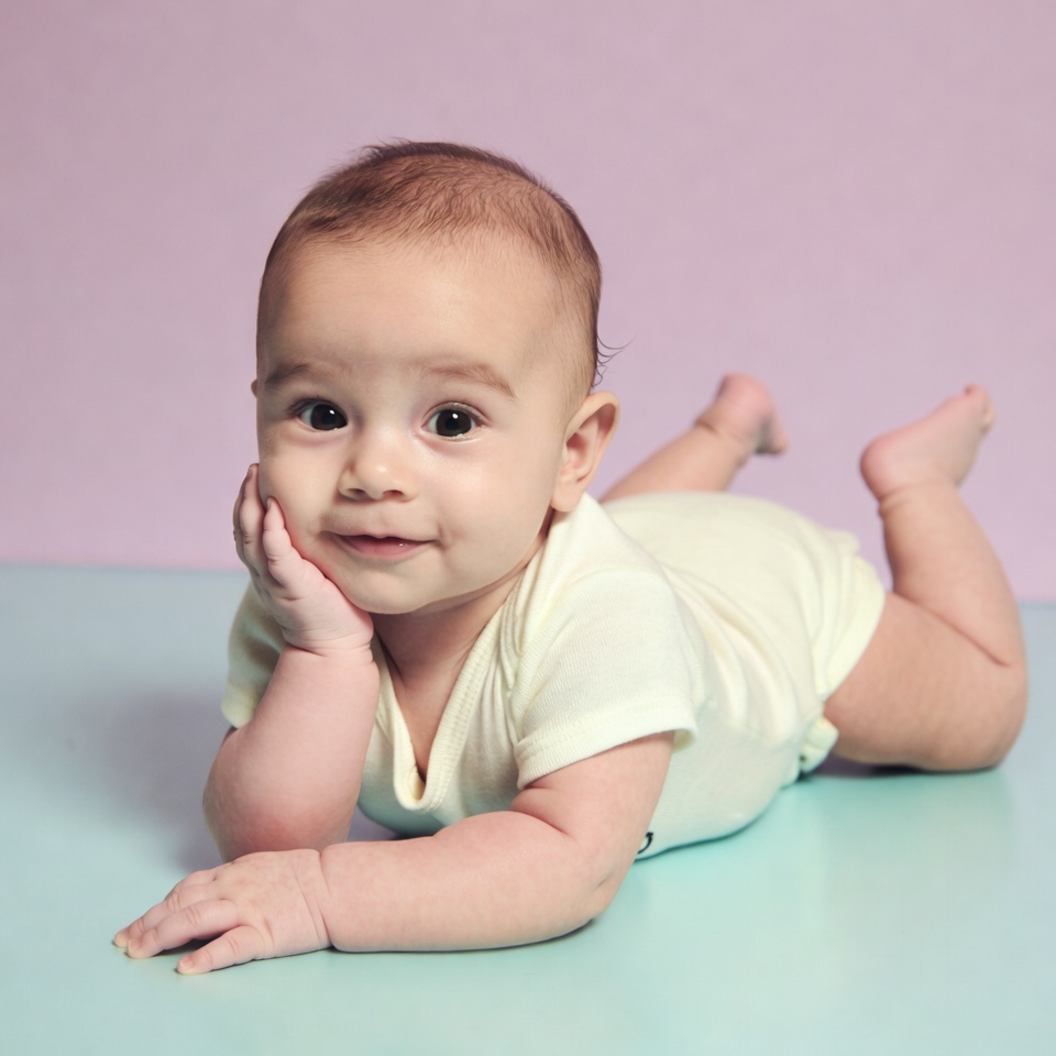 Baby playing on soft surface Baby playing on soft surface