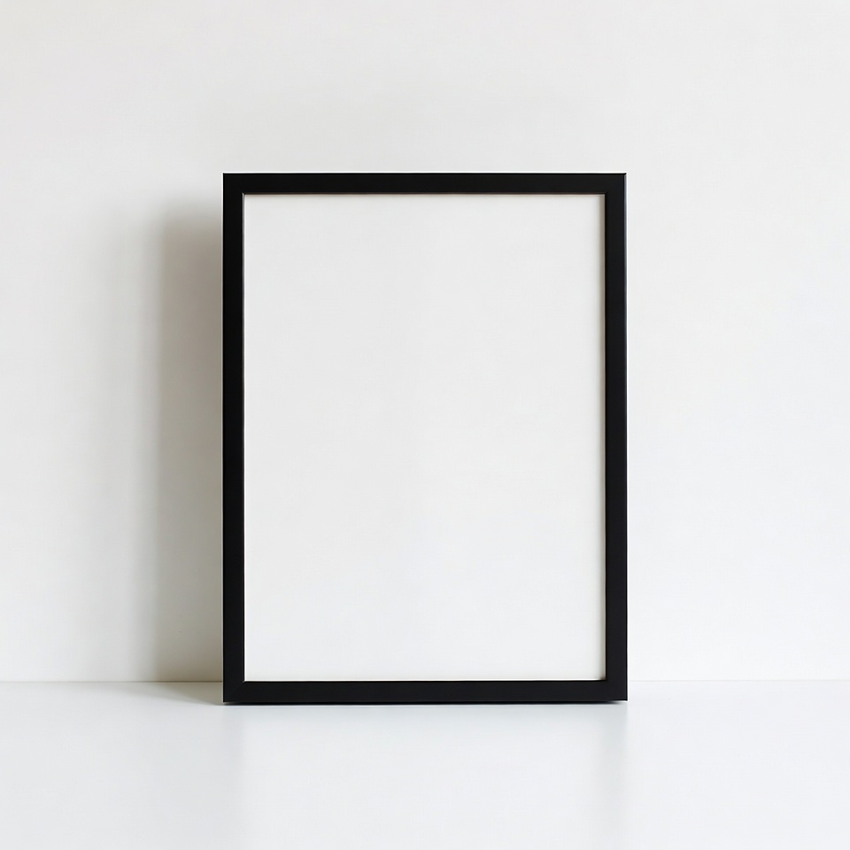 Empty black frame on white wall Empty black frame on white wall