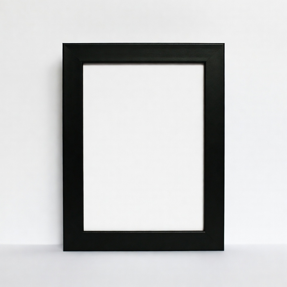 Empty black frame on white wall Empty black frame on white wall