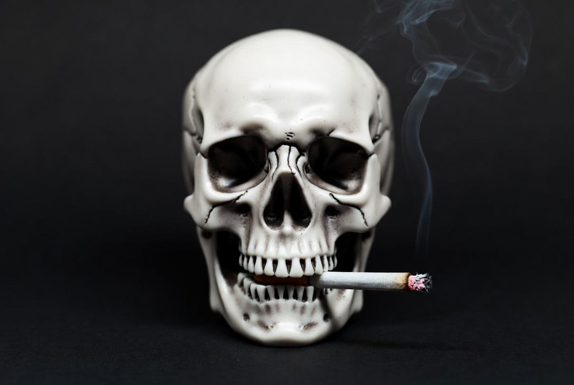 Skull with cigarette and smoke Skull with cigarette and smoke