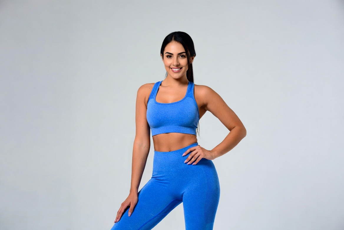 Woman posing in blue workout clothing Woman posing in blue workout clothing