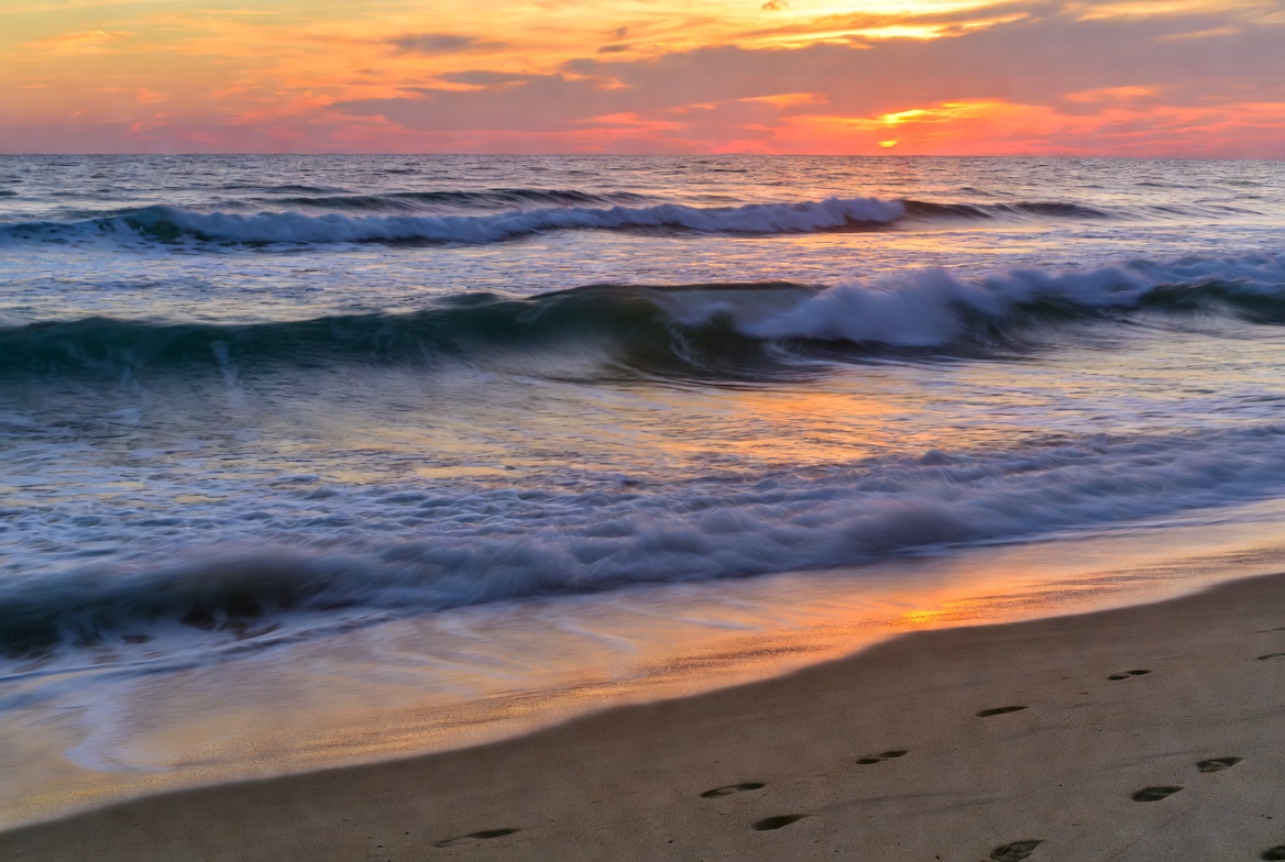 Sunset at the beach with waves Sunset at the beach with waves