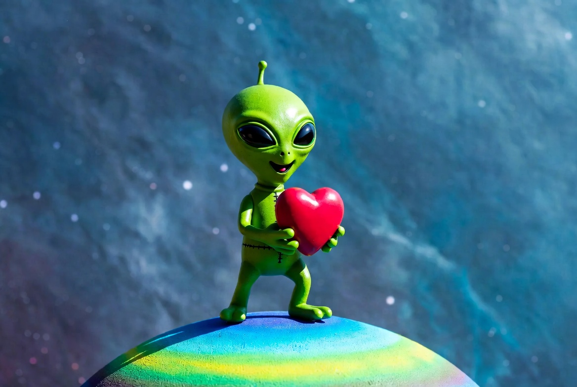 Alien holds heart on colorful planet Alien holds heart on colorful planet