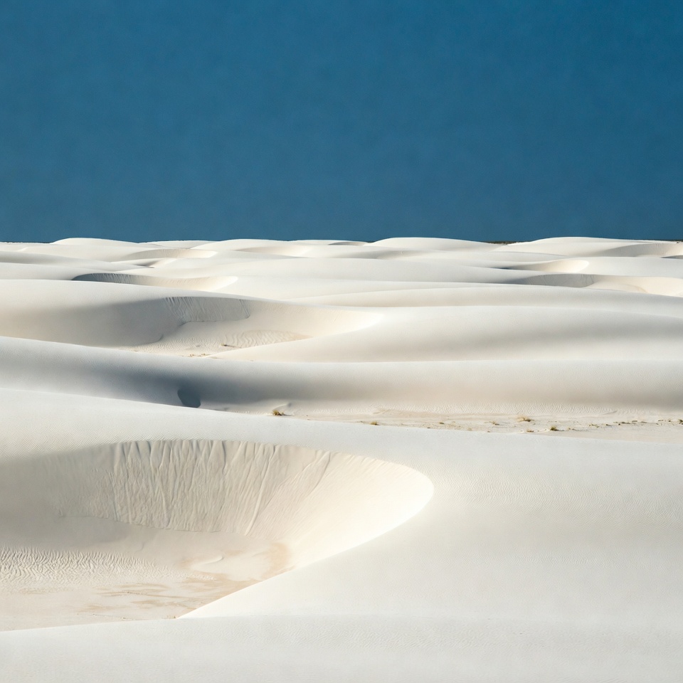 Desert landscape with white dunes and blue sky Desert landscape with white dunes and blue sky