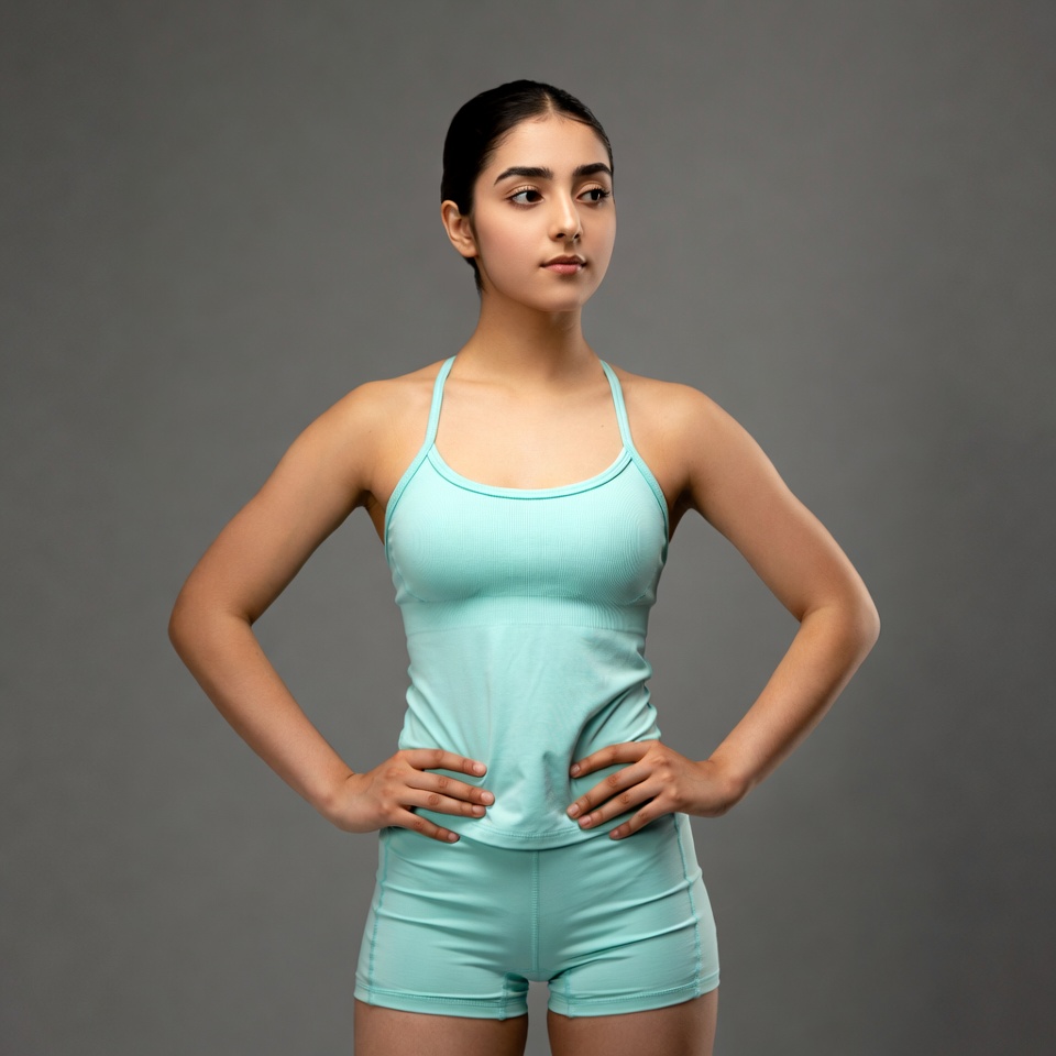 Young person wearing workout clothes indoors Young person wearing workout clothes indoors