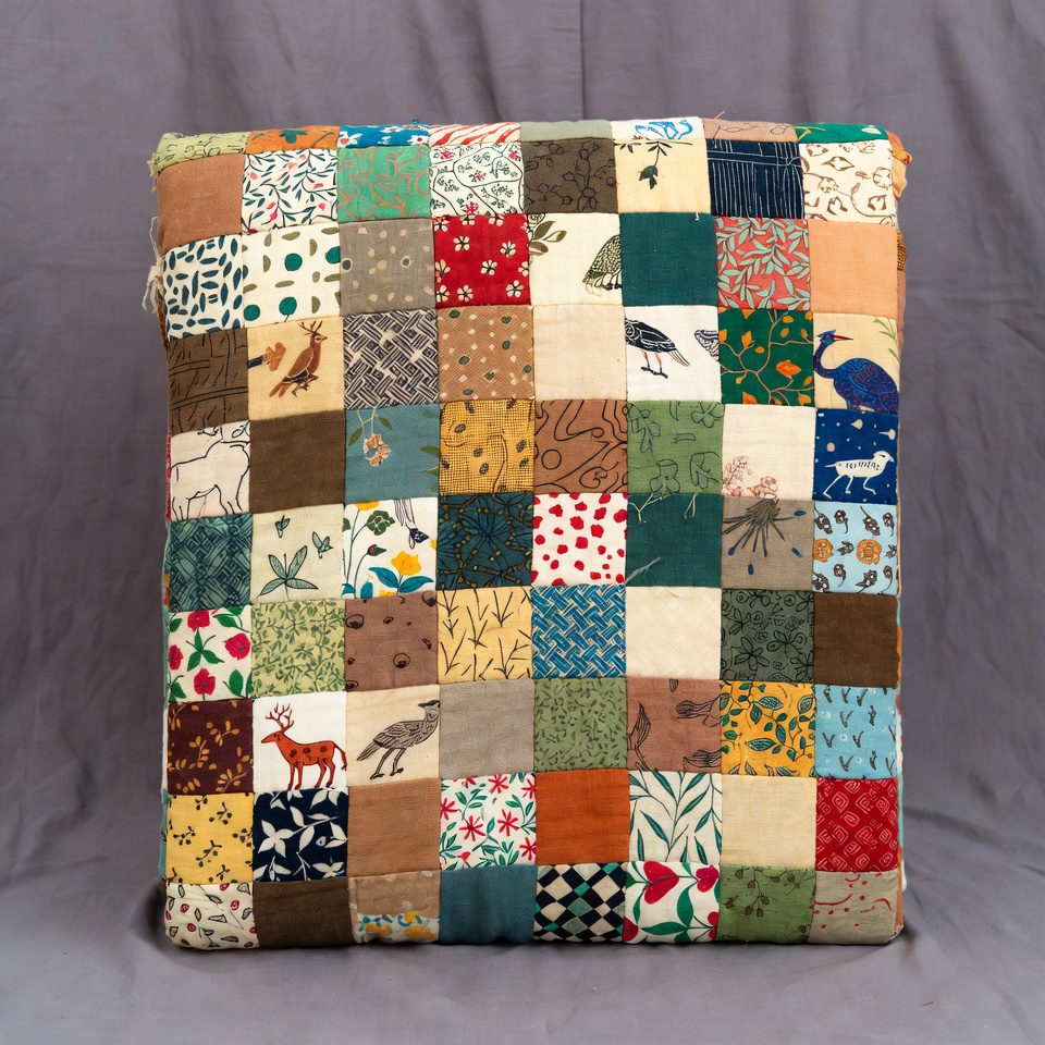 Colorful patchwork cushion on display Colorful patchwork cushion on display