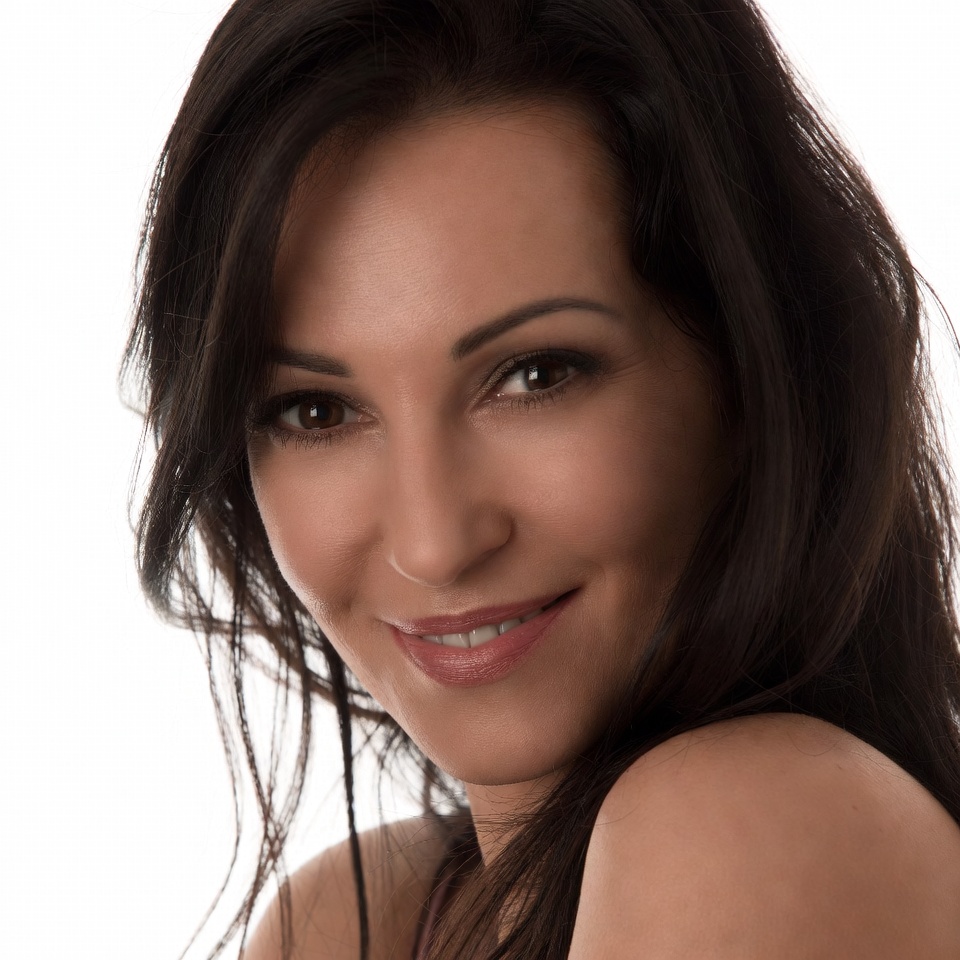 Smiling woman with long dark hair Smiling woman with long dark hair