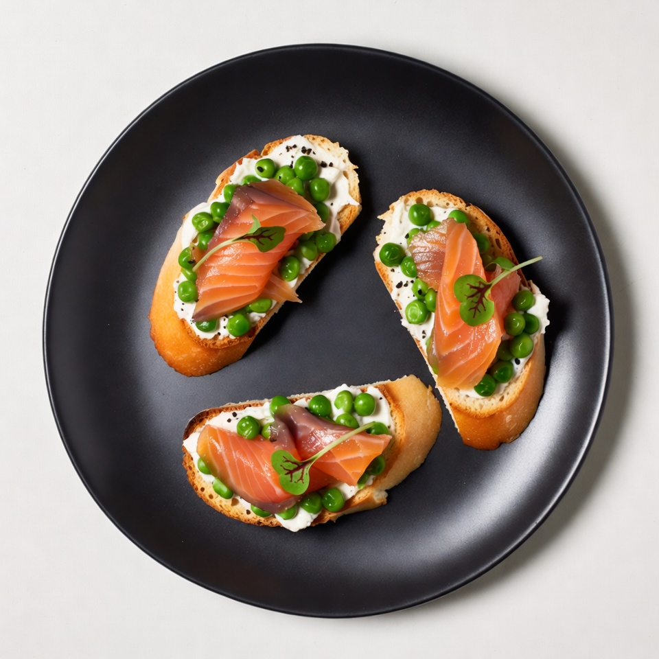 Salmon Pea Cream Toasts on Black Plate Salmon Pea Cream Toasts on Black Plate