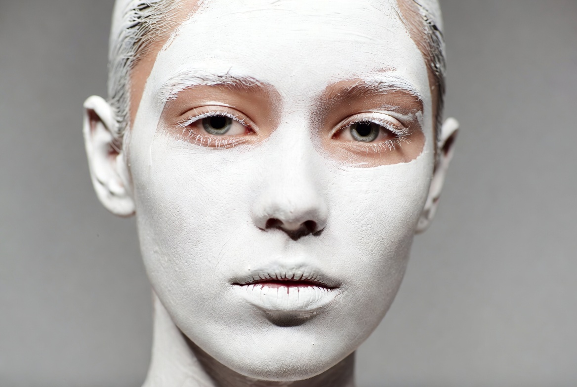 Woman with white face paint Woman with white face paint