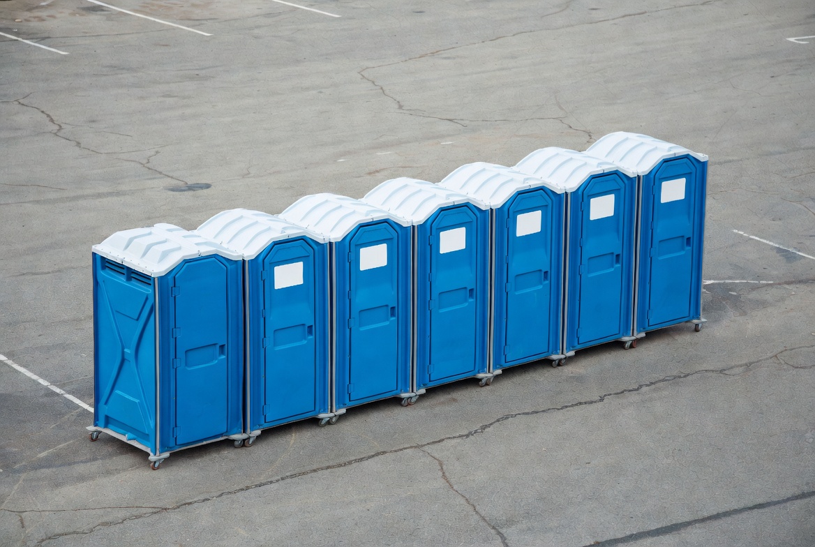 Row of Blue Portable Toilets Row of Blue Portable Toilets
