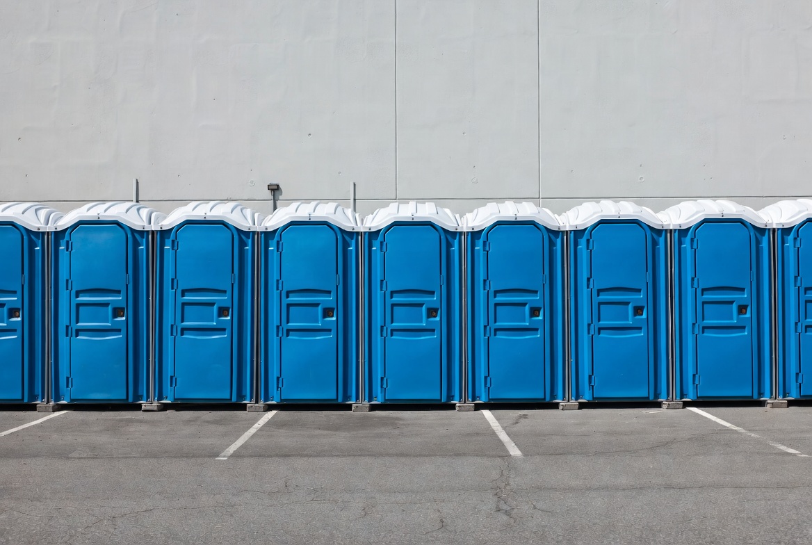 Row of Blue Portable Toilets Row of Blue Portable Toilets