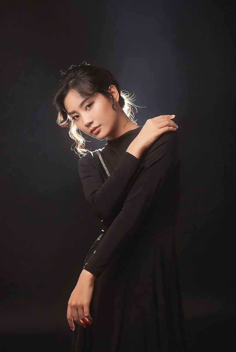 Asian woman in black dress posing Asian woman in black dress posing