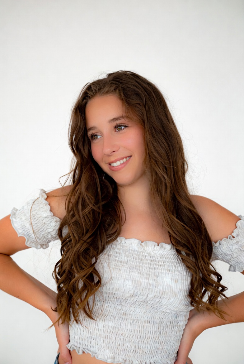 Teen girl smiling with hands on hips Teen girl smiling with hands on hips