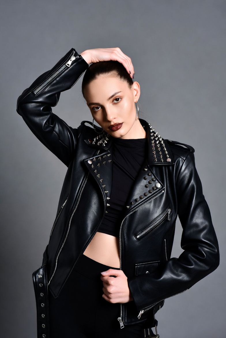 Woman in studded black leather jacket Woman in studded black leather jacket