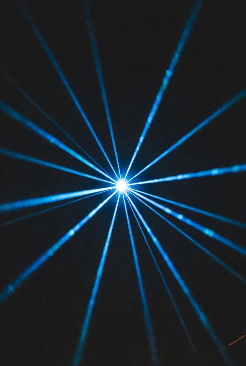 Blue Laser Beams Radiating Outward Blue Laser Beams Radiating Outward