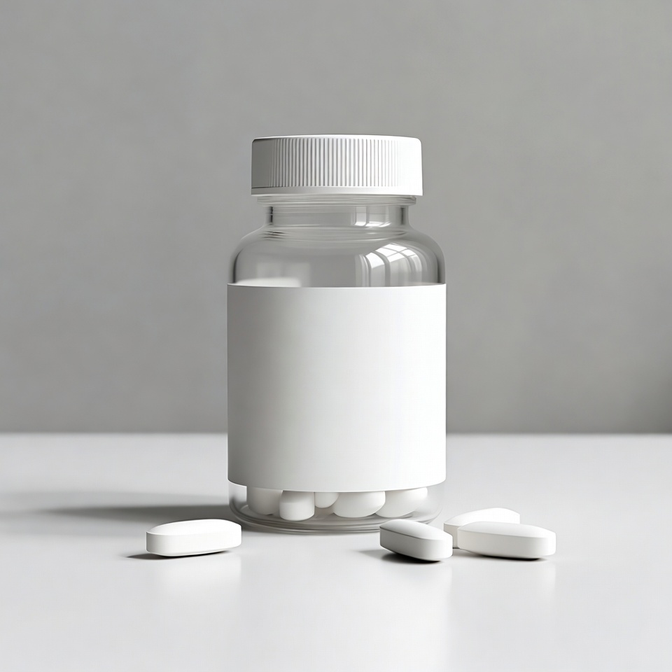 White pills spilling from bottle White pills spilling from bottle