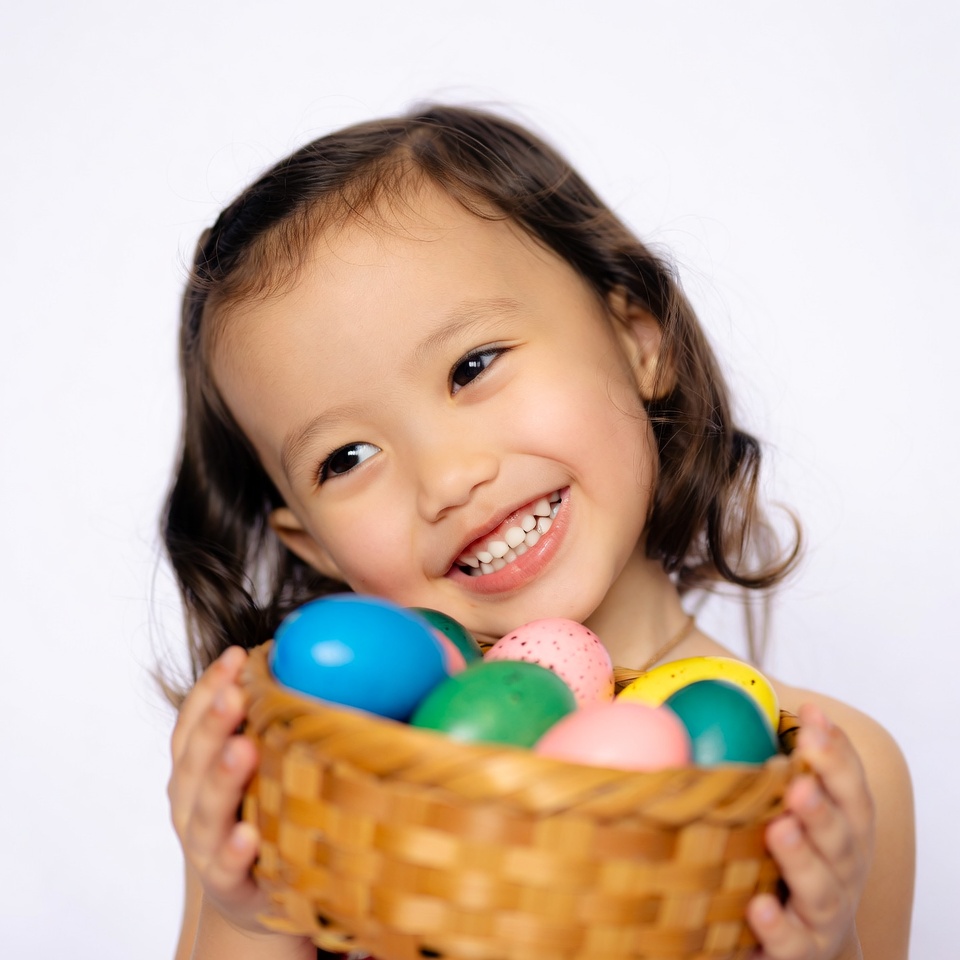Asian girl holding Easter eggs Asian girl holding Easter eggs