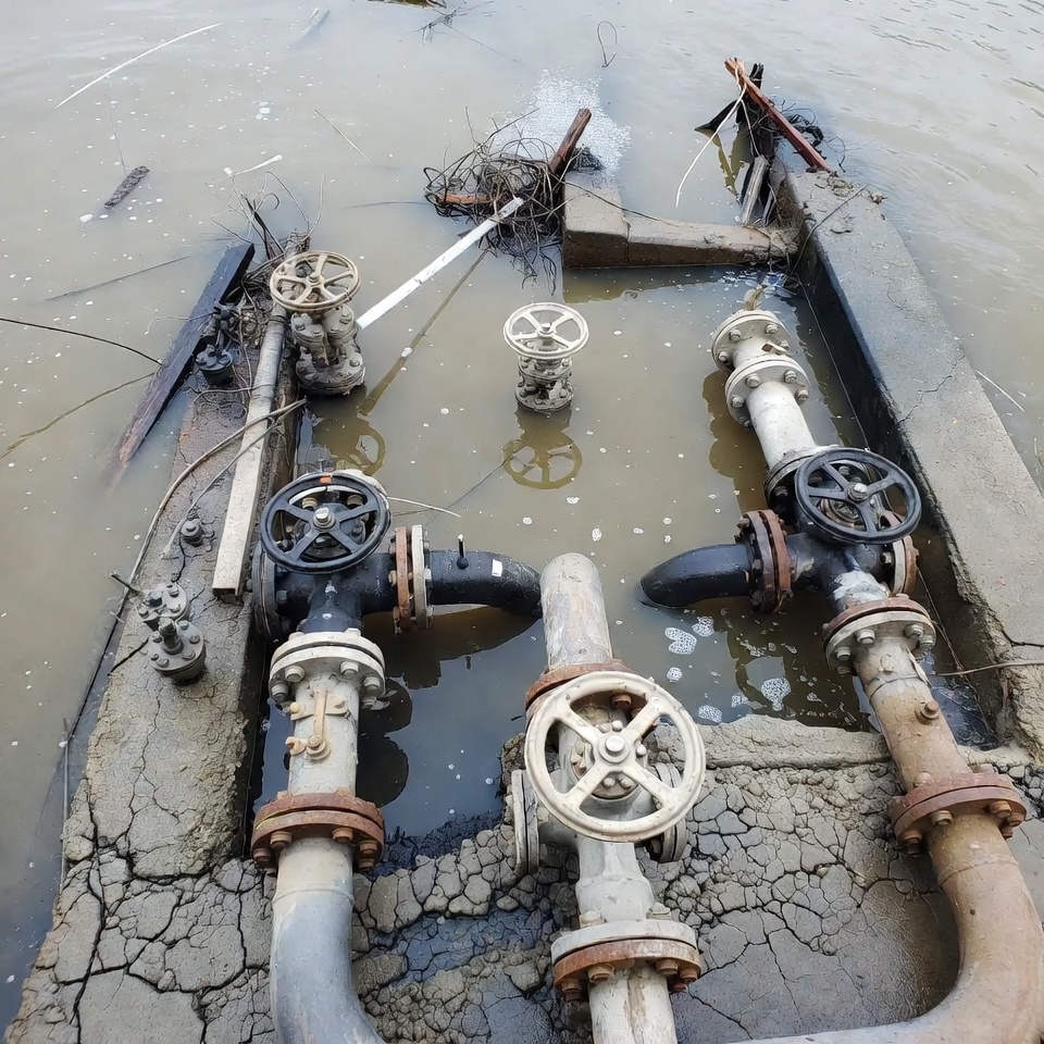 Flooded industrial pipes and valves Flooded industrial pipes and valves