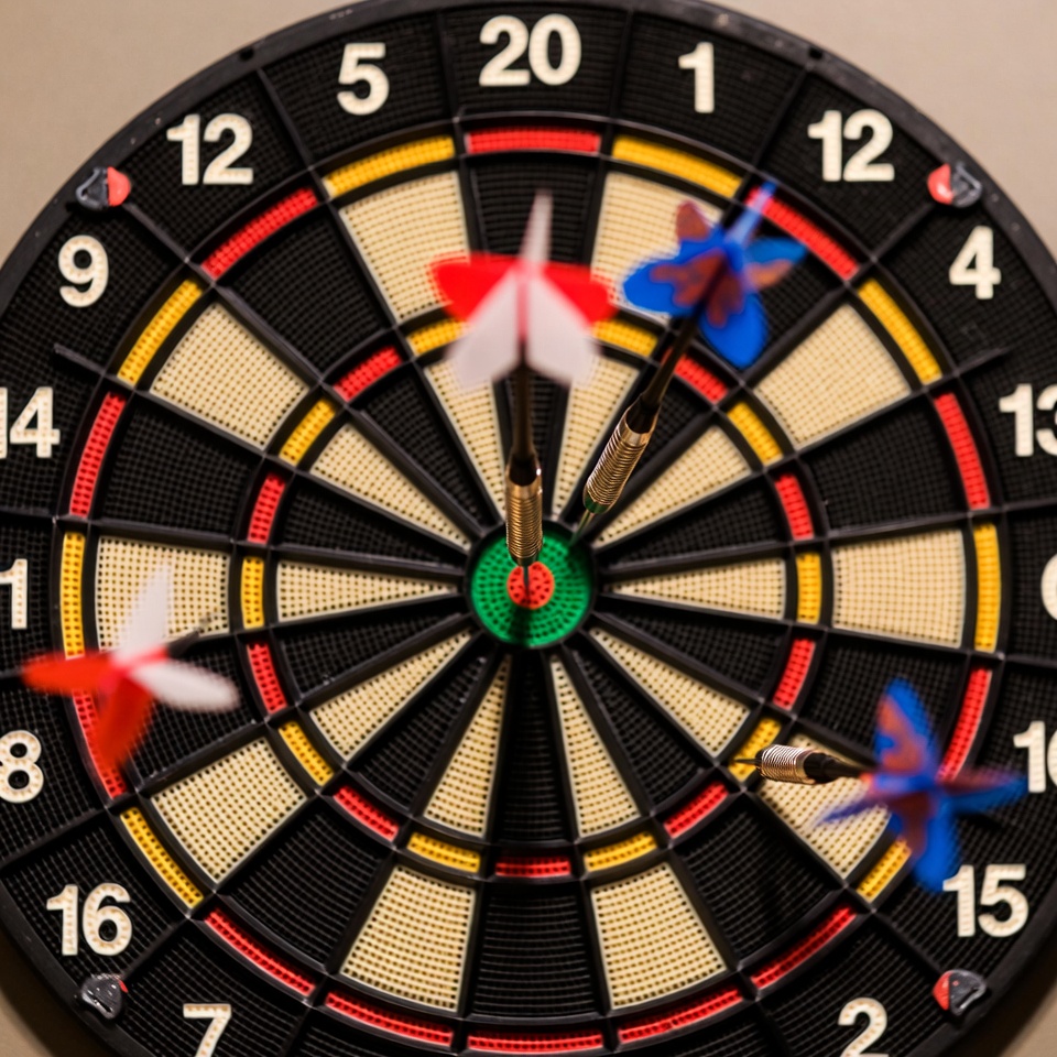 Dartboard with colorful darts Dartboard with colorful darts