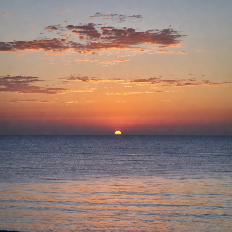 Sunset over calm ocean Sunset over calm ocean