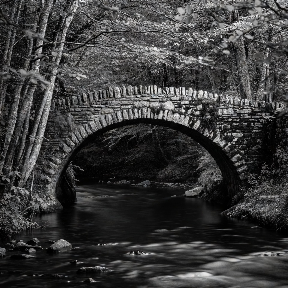 Stone Arch Bridge over Forest Stream Stone Arch Bridge over Forest Stream