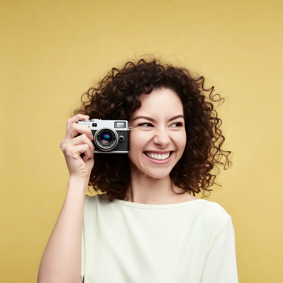 Woman holding vintage camera Woman holding vintage camera