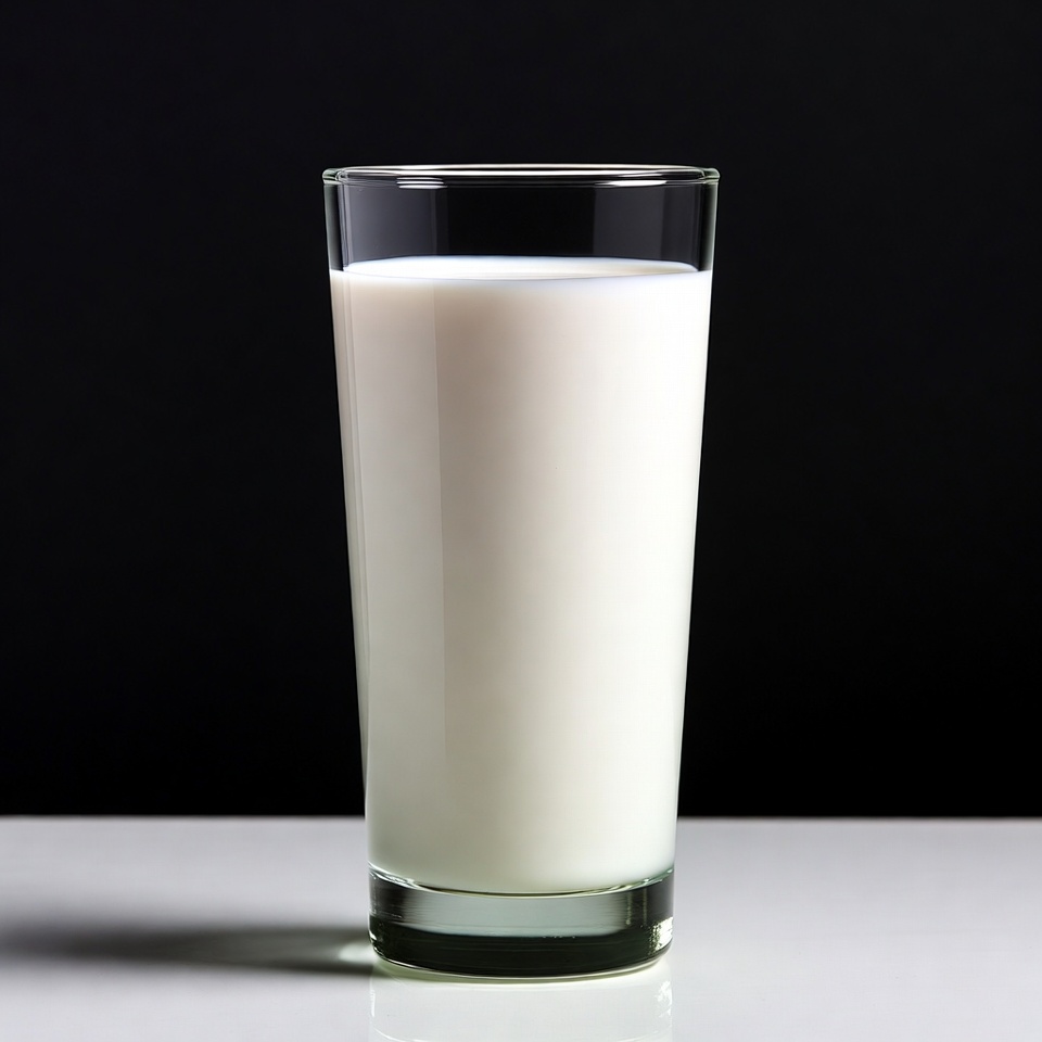 Glass of milk on black background Glass of milk on black background