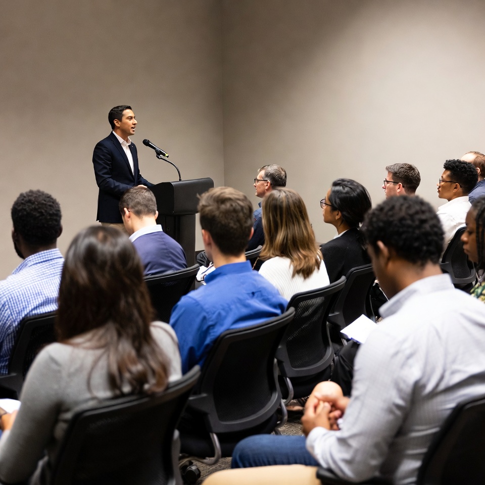 Man speaking at business conference Man speaking at business conference