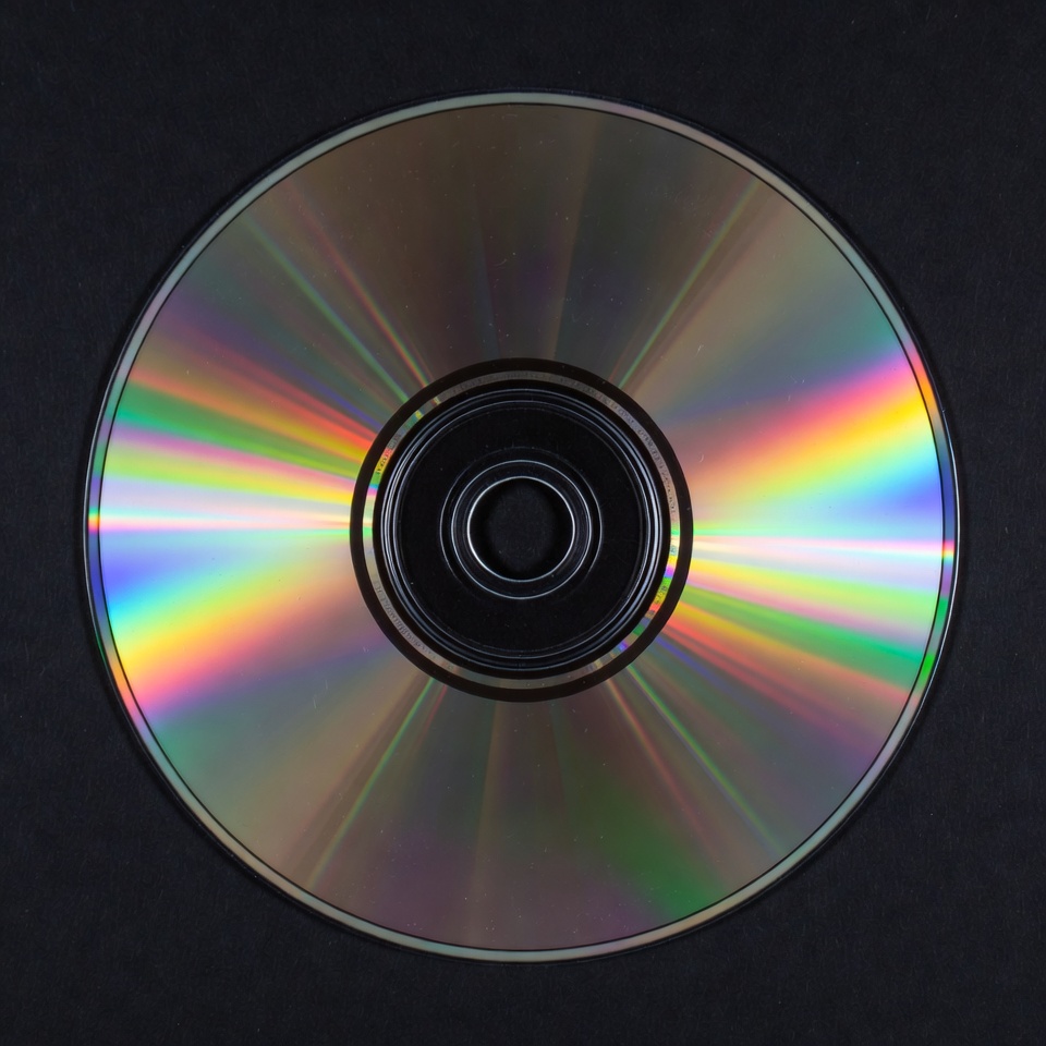Shiny CD Disc on Black Background Shiny CD Disc on Black Background
