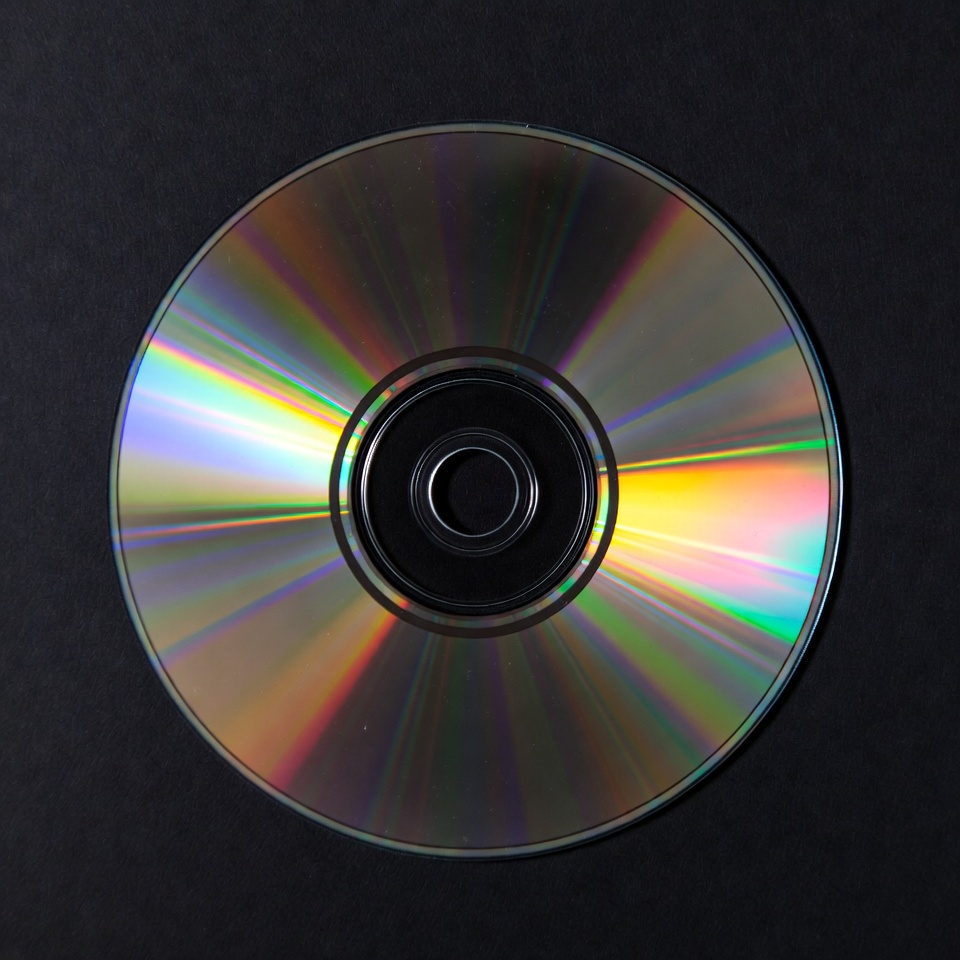 Shiny CD Disc on Black Background Shiny CD Disc on Black Background