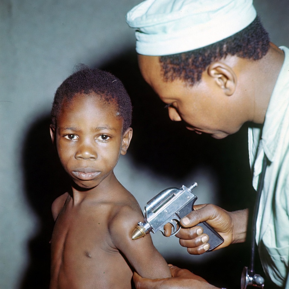 Doctor vaccinating young boy Doctor vaccinating young boy
