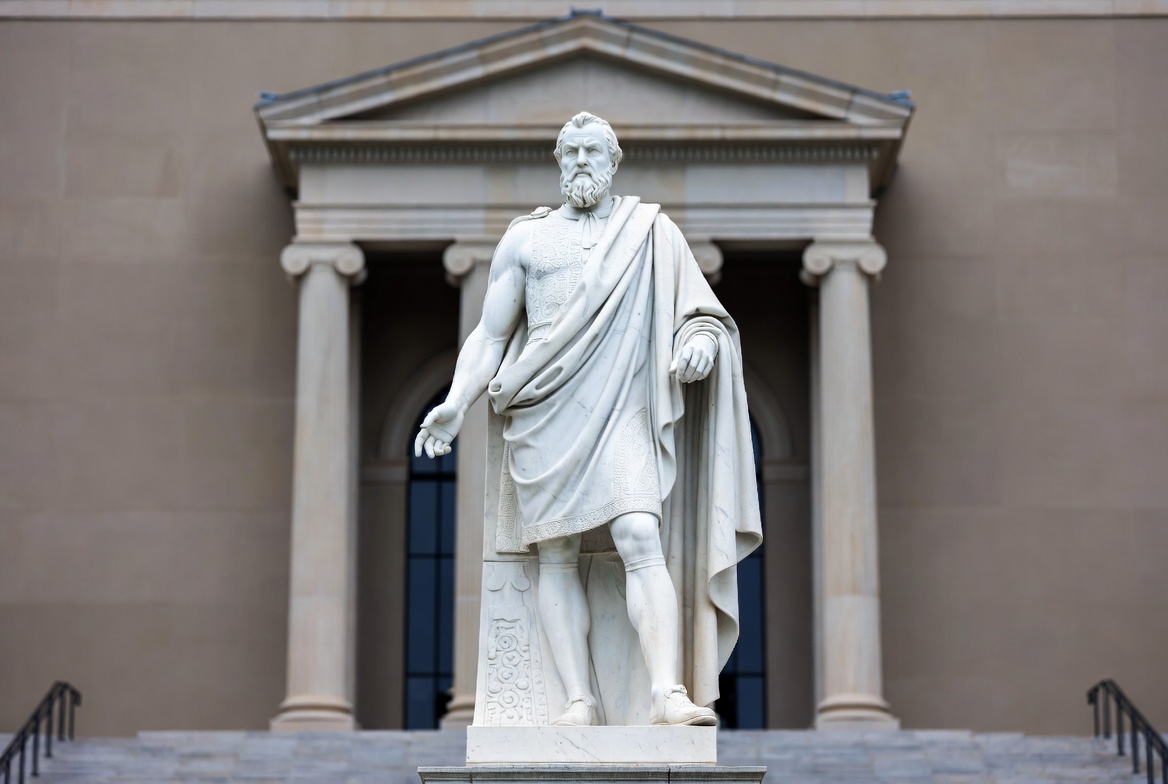 White marble statue of bearded man in toga White marble statue of bearded man in toga