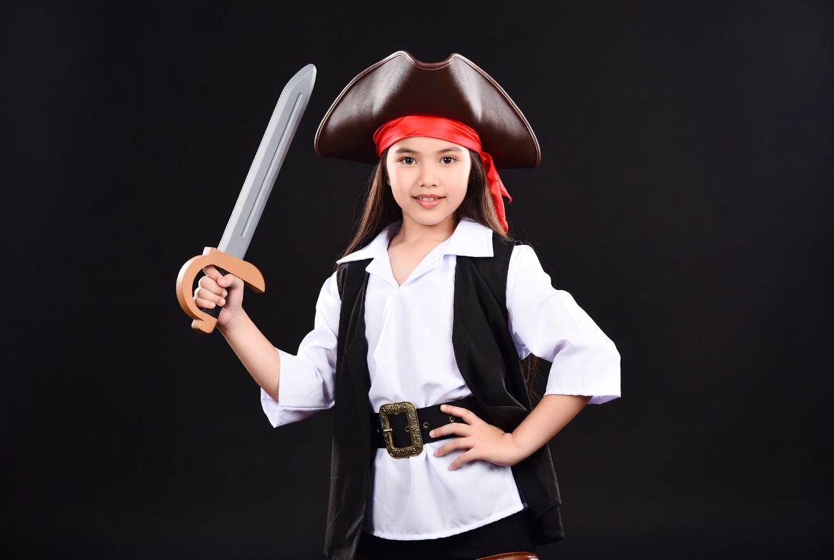 Asian girl in pirate costume with sword Asian girl in pirate costume with sword