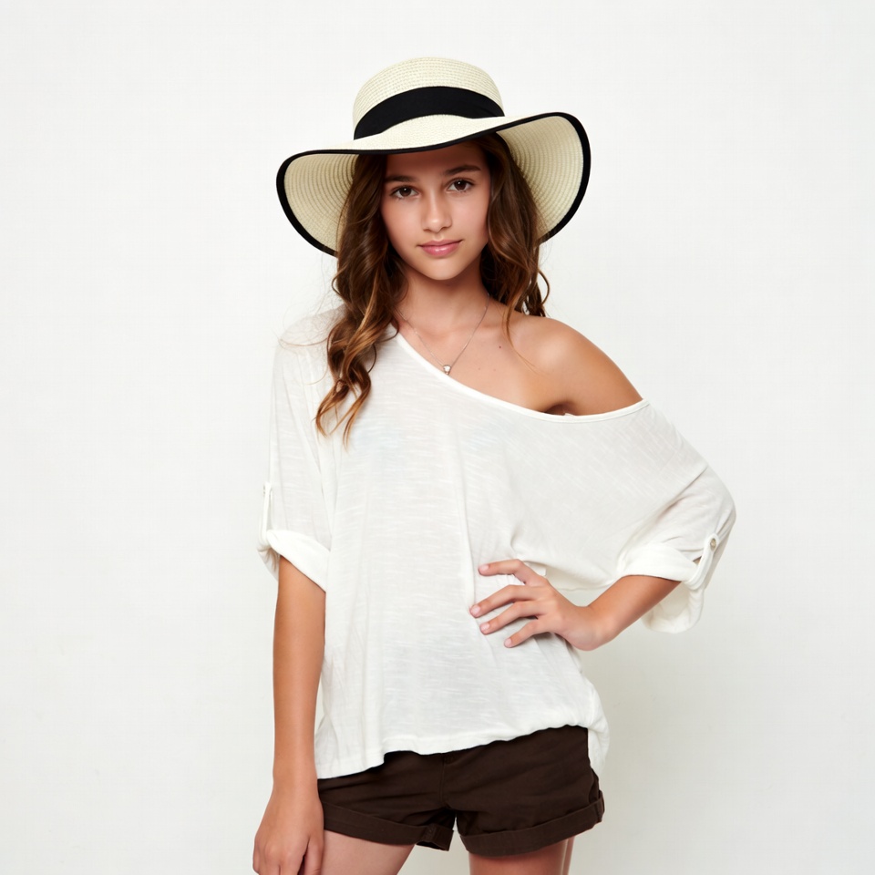 Girl wearing wide-brim hat and off-shoulder top Girl wearing wide-brim hat and off-shoulder top