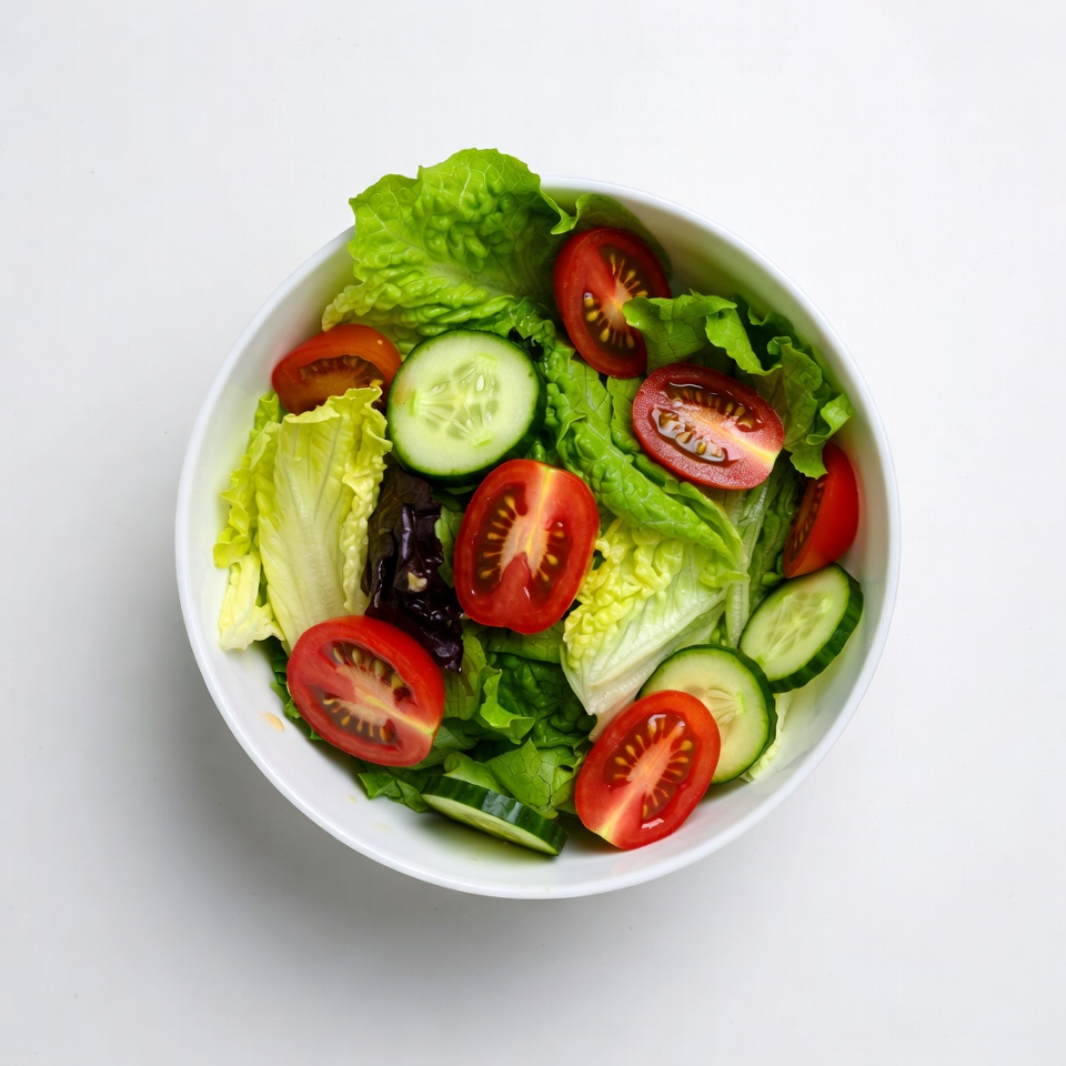 Fresh salad with lettuce tomatoes cucumbers Fresh salad with lettuce tomatoes cucumbers