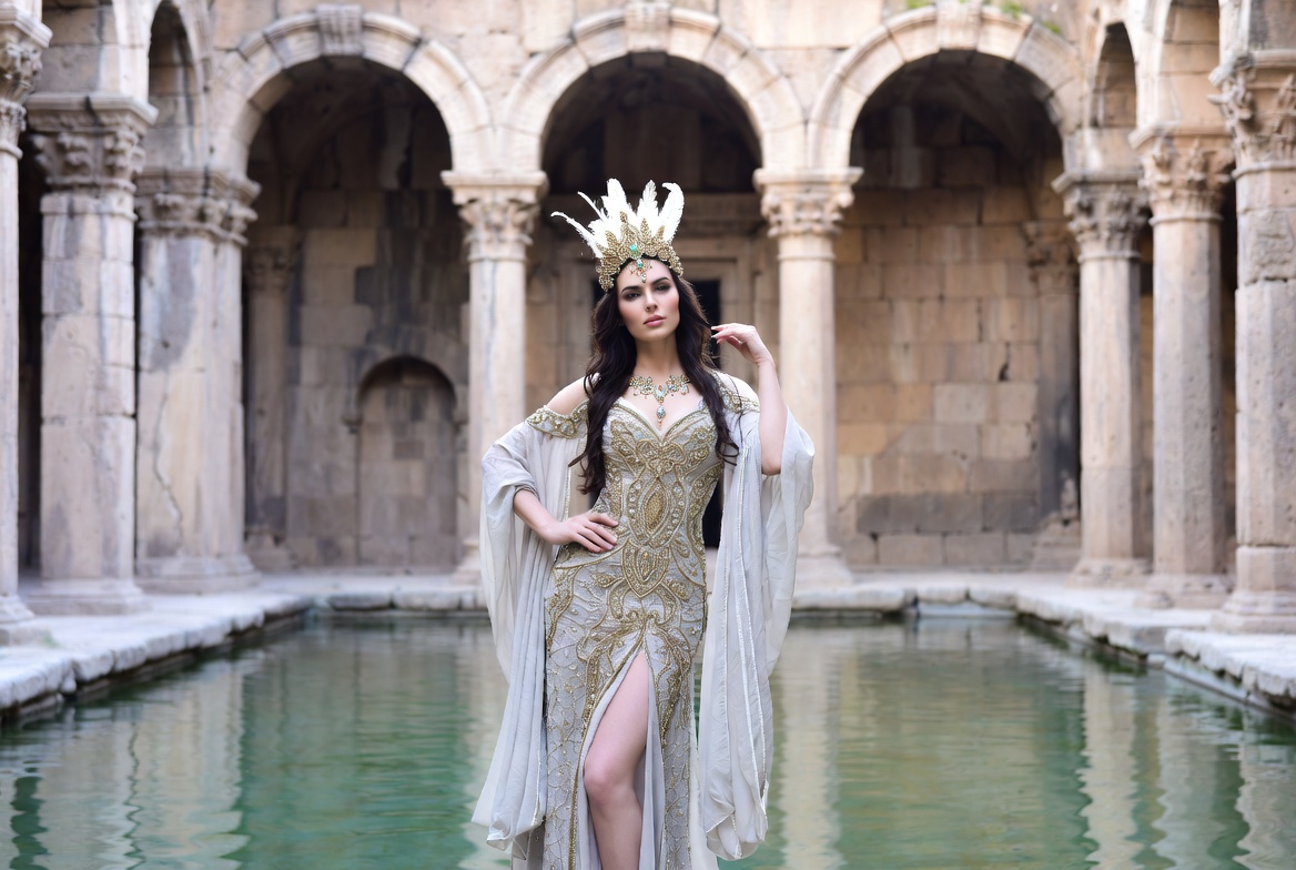 Woman in Feather Headdress by Pool Woman in Feather Headdress by Pool