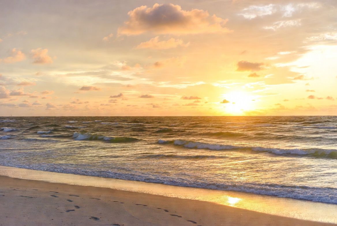 Sunset over ocean beach Sunset over ocean beach