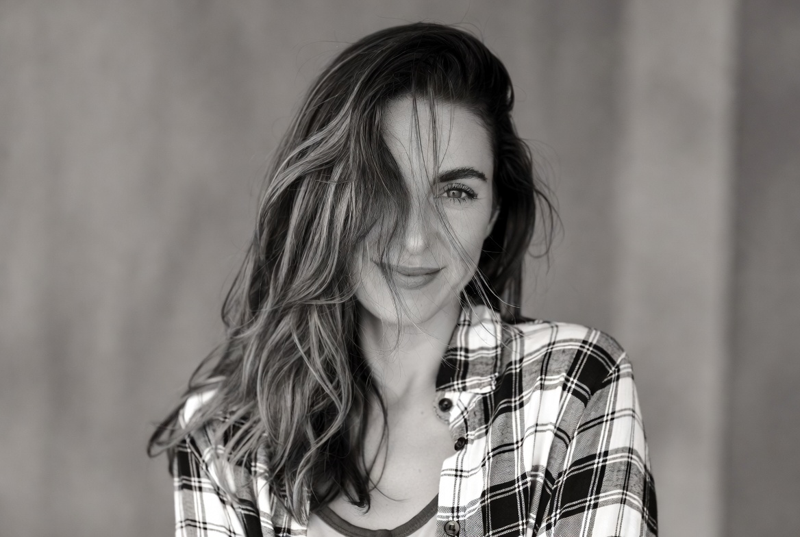 Smiling woman with wavy hair Smiling woman with wavy hair