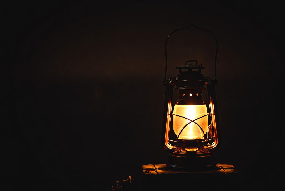 Vintage Lantern Glowing on Wood Vintage Lantern Glowing on Wood