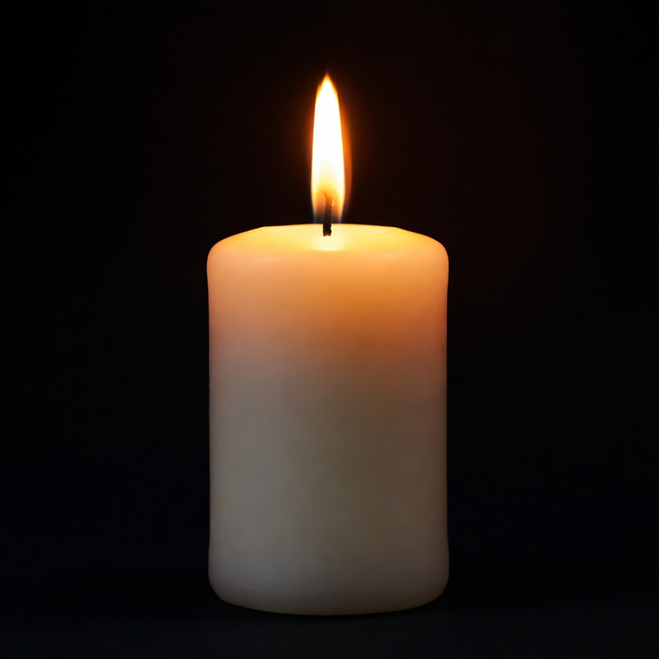 Burning Candle on Black Background Burning Candle on Black Background