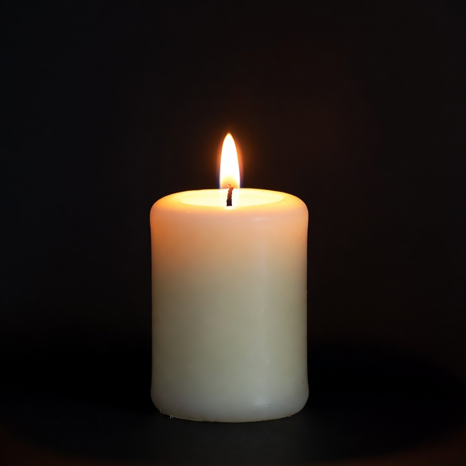 Burning Candle on Black Background Burning Candle on Black Background