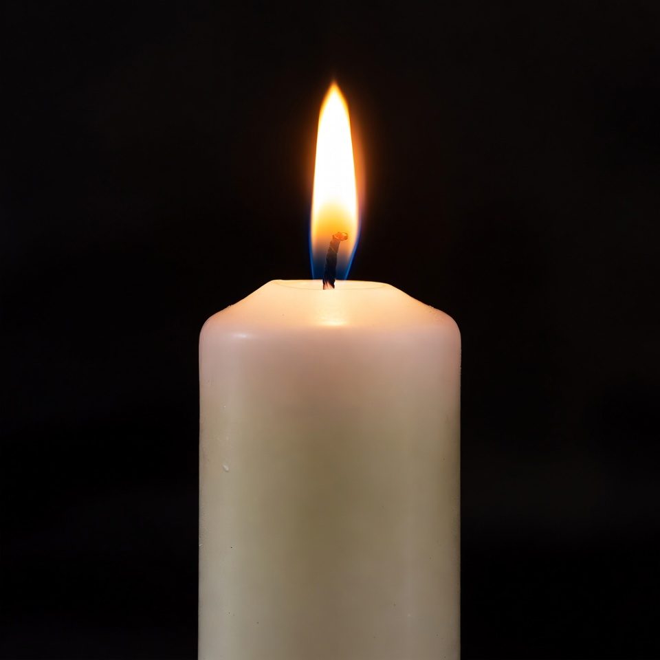 Burning Candle on Black Background Burning Candle on Black Background