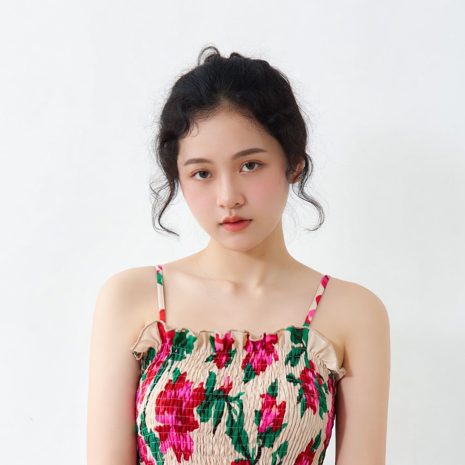 Asian woman in floral spaghetti strap top Asian woman in floral spaghetti strap top